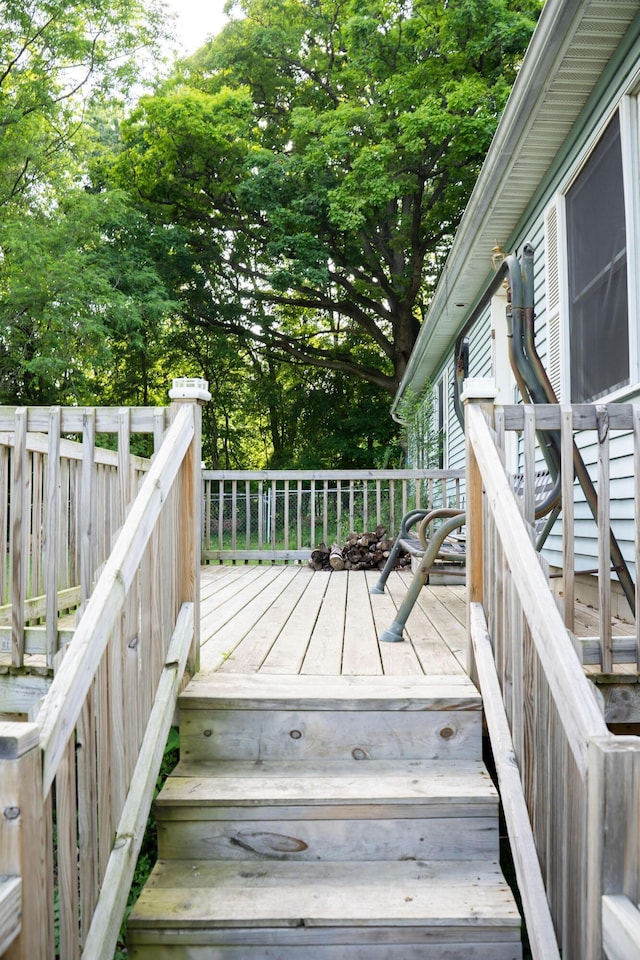 181 Spring St, Hillsdale, MI 49242 - wooden deck featuring view of wooded area