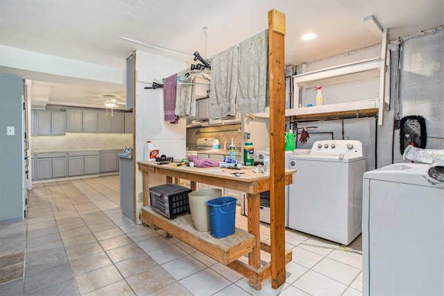 11303 W Dr N, Bellevue, MI 49021 - laundry area featuring washing machine and dryer, light tile patterned floors, ceiling fan, and a workshop area
