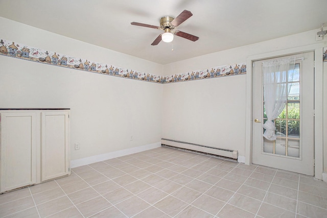 11303 W Dr N, Bellevue, MI 49021 - spare room with baseboard heating, a ceiling fan, and light tile patterned floors