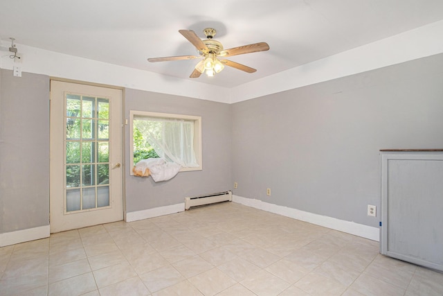 11303 W Dr N, Bellevue, MI 49021 - empty room with baseboard heating, ceiling fan, and light tile patterned flooring