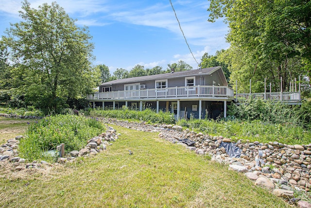 11303 W Dr N, Bellevue, MI 49021 - back of house with a deck and a lawn