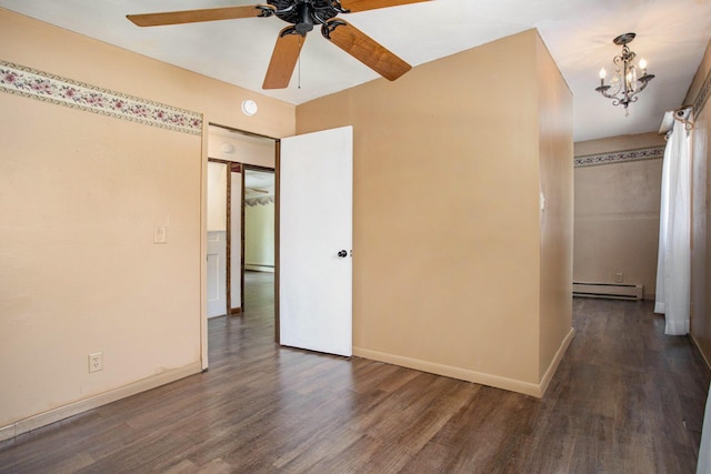 11303 W Dr N, Bellevue, MI 49021 - spare room featuring a baseboard radiator, ceiling fan, wood finished floors, a chandelier, and a smoke detector