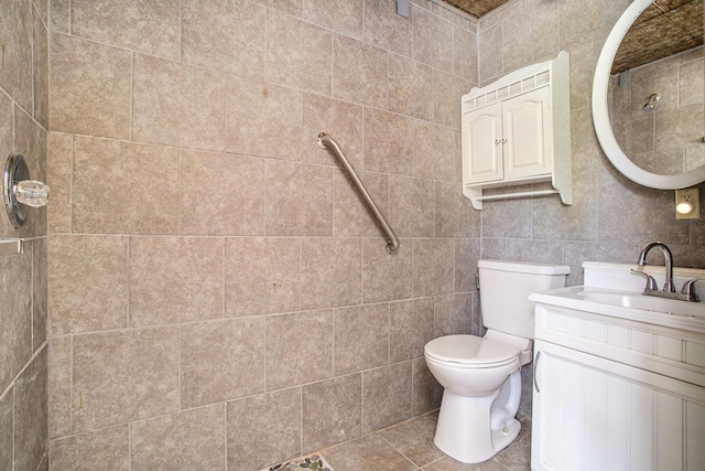 11303 W Dr N, Bellevue, MI 49021 - full bathroom featuring vanity, tile walls, tile patterned flooring, and a shower