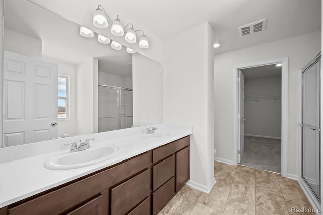 48495 Old Oak Trl, Van Buren, MI 48111 - bathroom with a shower stall, double vanity, and a spacious closet