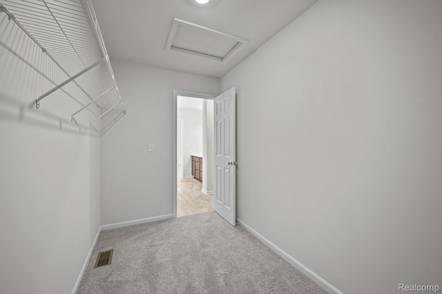 48495 Old Oak Trl, Van Buren, MI 48111 - spacious closet featuring attic access and carpet flooring