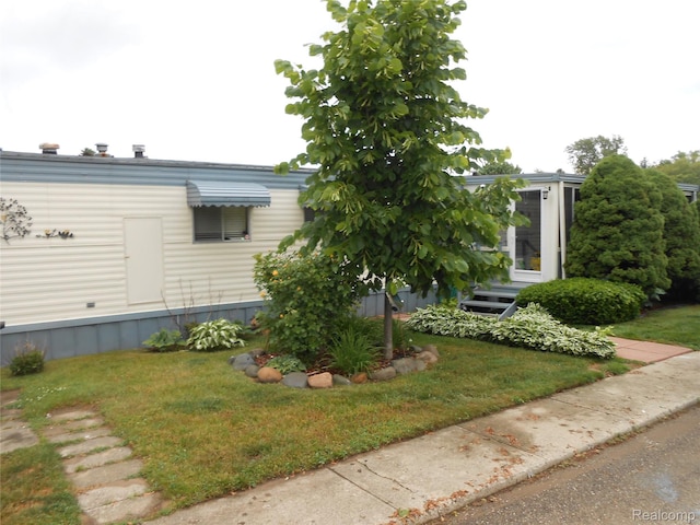 626 Barefoot Ln, Port Sanilac, MI 48469 - view of home's exterior featuring a yard