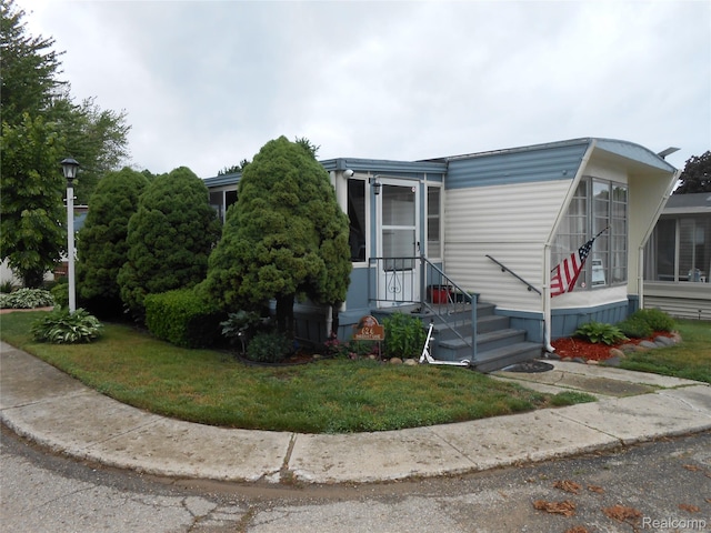626 Barefoot Ln, Port Sanilac, MI 48469 - view of front facade with a front lawn