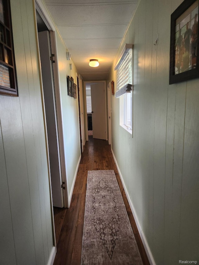 626 Barefoot Ln, Port Sanilac, MI 48469 - hall featuring dark wood finished floors and wooden walls