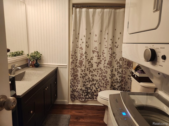 626 Barefoot Ln, Port Sanilac, MI 48469 - bathroom with stacked washer and clothes dryer, vanity, wood finished floors, and curtained shower
