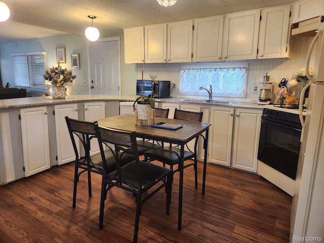 626 Barefoot Ln, Port Sanilac, MI 48469 - kitchen featuring gas stove, black microwave, white cabinets, dark wood-type flooring, and light stone counters