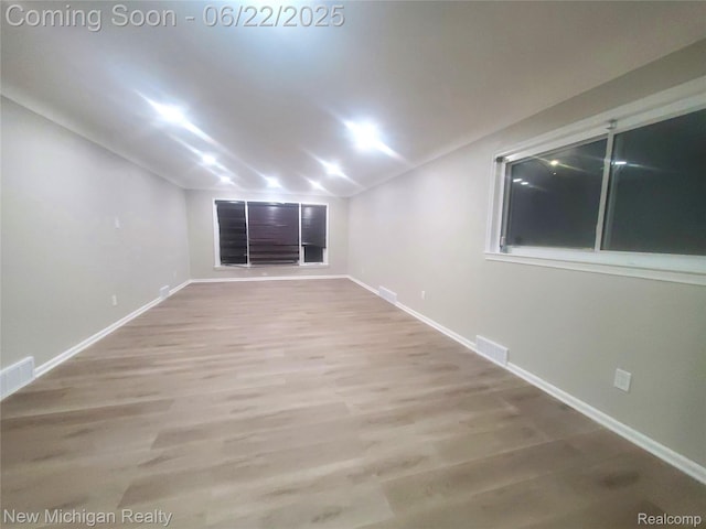 22221 Marlow St, Oak Park, MI 48237 - spare room with lofted ceiling and wood finished floors