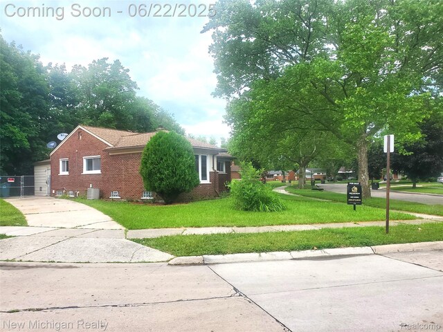 22221 Marlow St, Oak Park, MI 48237 - view of property exterior featuring brick siding and a yard
