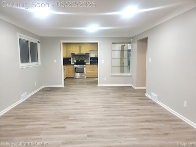 22221 Marlow St, Oak Park, MI 48237 - unfurnished living room with baseboards and light wood-style flooring