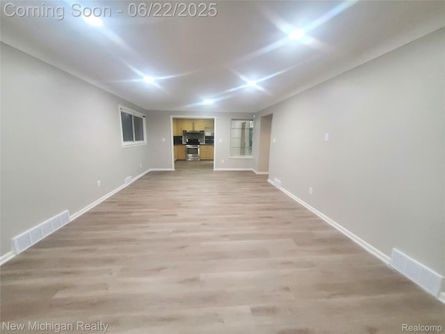 22221 Marlow St, Oak Park, MI 48237 - unfurnished living room with baseboards and light wood-style floors