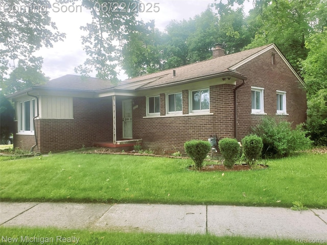 22221 Marlow St, Oak Park, MI 48237 - ranch-style home with brick siding, a chimney, and a front yard