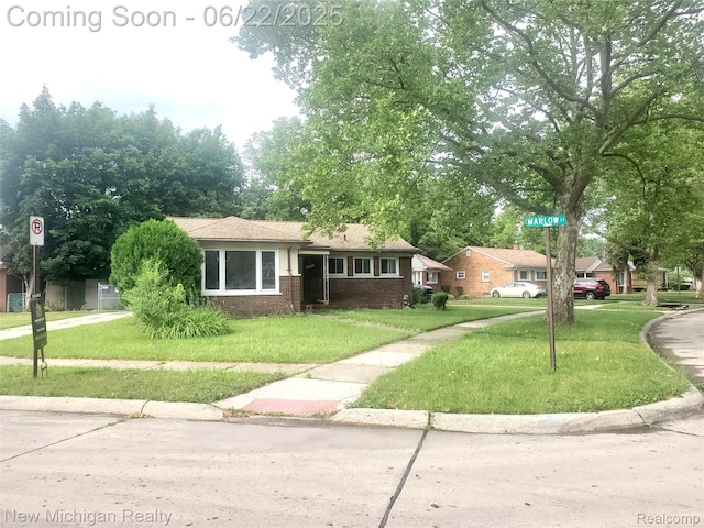 22221 Marlow St, Oak Park, MI 48237 - view of front facade with brick siding and a front yard