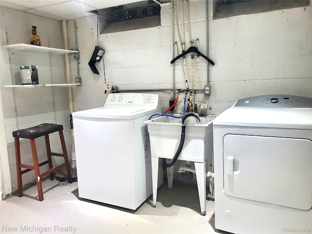 22221 Marlow St, Oak Park, MI 48237 - laundry area with independent washer and dryer and concrete block wall