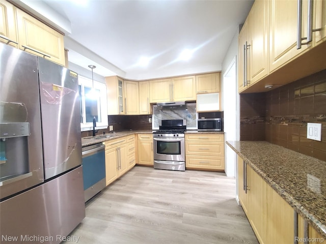 22221 Marlow St, Oak Park, MI 48237 - kitchen featuring stainless steel appliances, light brown cabinets, tasteful backsplash, and dark stone countertops