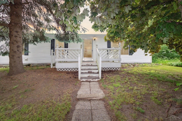 4150 Buzzell Rd, Gladwin, MI 48624 - view of property hidden behind natural elements featuring a wooden deck