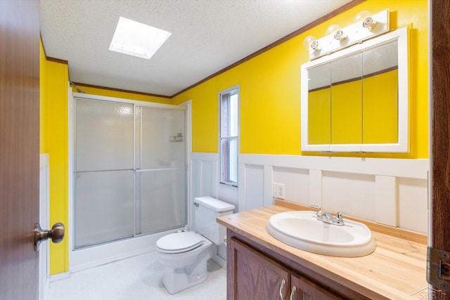 4150 Buzzell Rd, Gladwin, MI 48624 - full bathroom with a skylight, an enclosed shower, vanity, crown molding, and a wainscoted wall