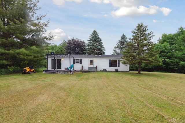 4150 Buzzell Rd, Gladwin, MI 48624 - back of property featuring a pergola and a yard