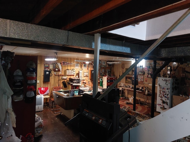420 N 14th St, Niles, MI 49120 - below grade area with a workshop area and freestanding refrigerator
