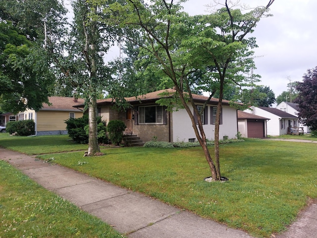 420 N 14th St, Niles, MI 49120 - ranch-style house with a front yard, an attached garage, and brick siding