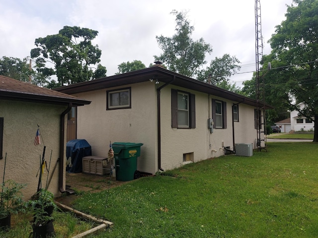 420 N 14th St, Niles, MI 49120 - view of home's exterior with stucco siding and a lawn