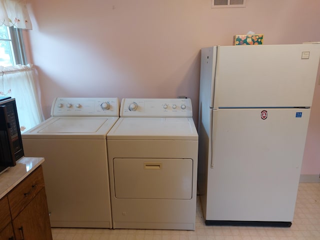 420 N 14th St, Niles, MI 49120 - washroom featuring light floors and washing machine and dryer