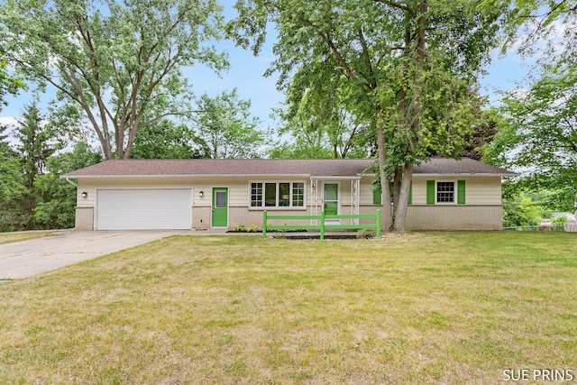 2611 Wabash Dr NE, Grand Rapids, MI 49525 - single story home with brick siding, a garage, driveway, and a front yard