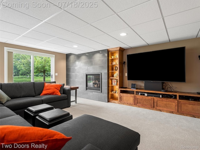 3551 Royal Berkshire Ln, Oakland, MI 48363 - carpeted living room featuring a tiled fireplace, a paneled ceiling, recessed lighting, and built in features