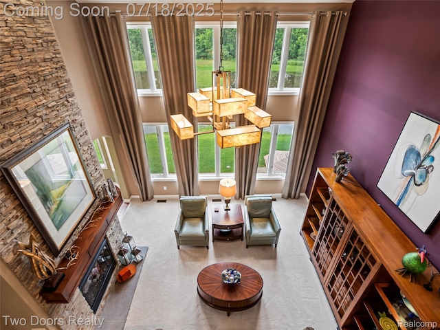 3551 Royal Berkshire Ln, Oakland, MI 48363 - living room featuring a fireplace and healthy amount of natural light