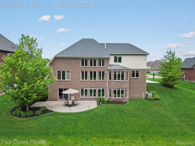 3551 Royal Berkshire Ln, Oakland, MI 48363 - rear view of house with a patio area, brick siding, and a yard