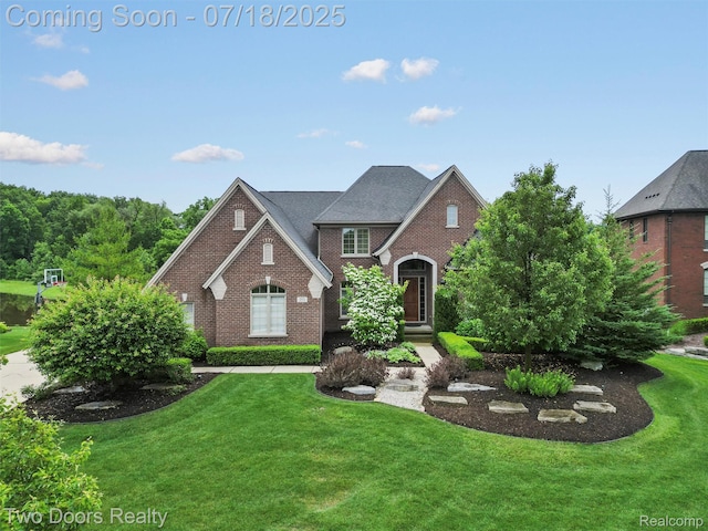 3551 Royal Berkshire Ln, Oakland, MI 48363 - view of front of property featuring brick siding and a front lawn