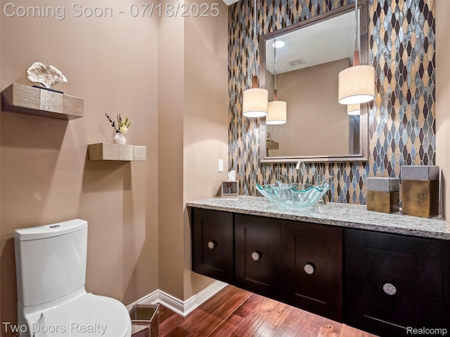 3551 Royal Berkshire Ln, Oakland, MI 48363 - half bathroom featuring wood finished floors and vanity