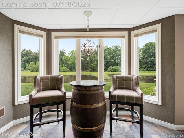 3551 Royal Berkshire Ln, Oakland, MI 48363 - sunroom with plenty of natural light, a chandelier, and a drop ceiling