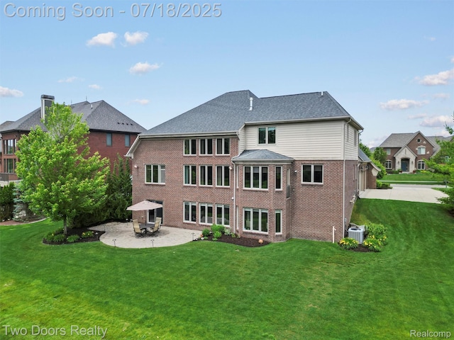 3551 Royal Berkshire Ln, Oakland, MI 48363 - rear view of property featuring brick siding, a patio, a lawn, concrete driveway, and a garage