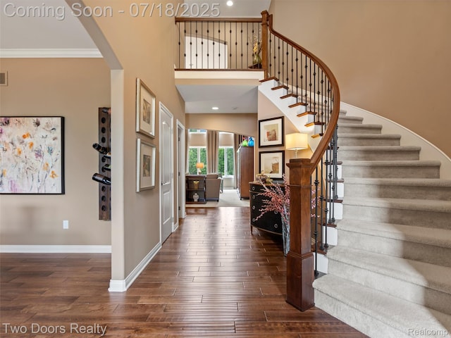 3551 Royal Berkshire Ln, Oakland, MI 48363 - foyer with stairs, dark wood-type flooring, crown molding, and recessed lighting