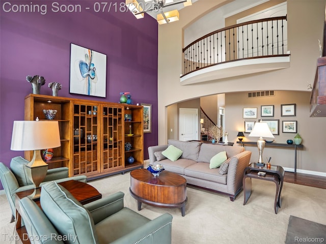3551 Royal Berkshire Ln, Oakland, MI 48363 - living area featuring a high ceiling, stairway, arched walkways, and carpet flooring