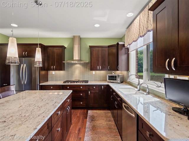 3551 Royal Berkshire Ln, Oakland, MI 48363 - kitchen with appliances with stainless steel finishes, wall chimney exhaust hood, decorative backsplash, decorative light fixtures, and recessed lighting