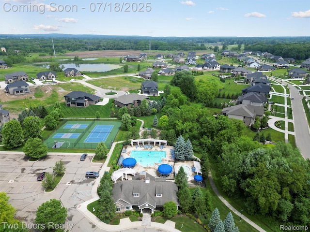 3551 Royal Berkshire Ln, Oakland, MI 48363 - aerial view of residential area with a large body of water and a pool area