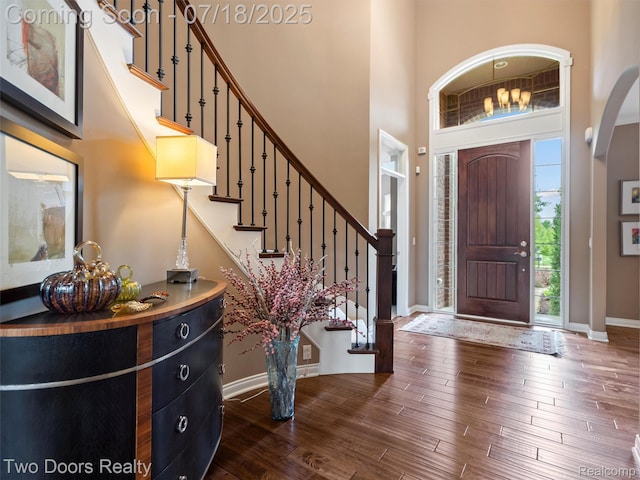 3551 Royal Berkshire Ln, Oakland, MI 48363 - foyer with a high ceiling, stairway, and dark wood-style floors