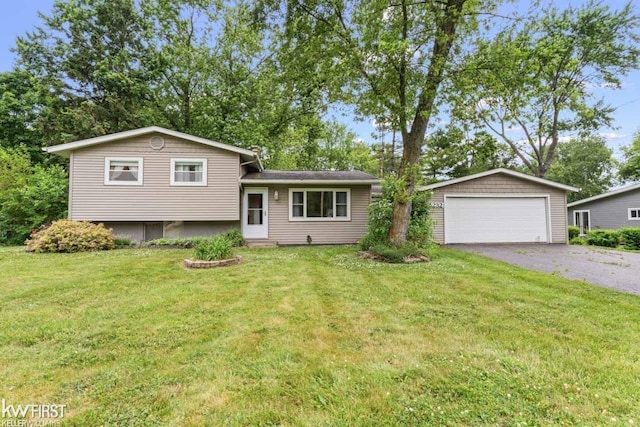 5232 Maple Ave, Swartz Creek, MI 48473 - tri-level home with a detached garage, a front yard, and an outbuilding