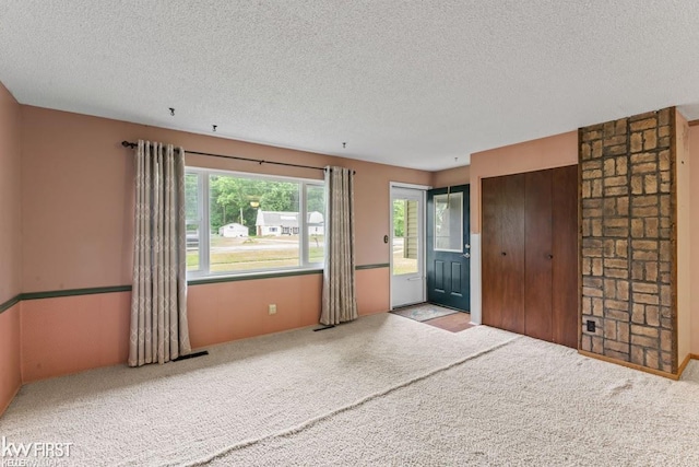 5232 Maple Ave, Swartz Creek, MI 48473 - unfurnished bedroom featuring a textured ceiling and carpet floors