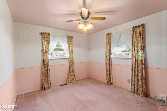 5232 Maple Ave, Swartz Creek, MI 48473 - spare room with ceiling fan, carpet, and wallpapered walls