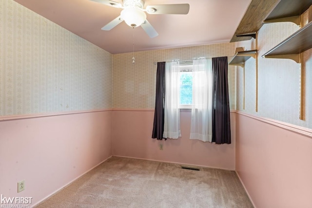 5232 Maple Ave, Swartz Creek, MI 48473 - carpeted spare room with a ceiling fan