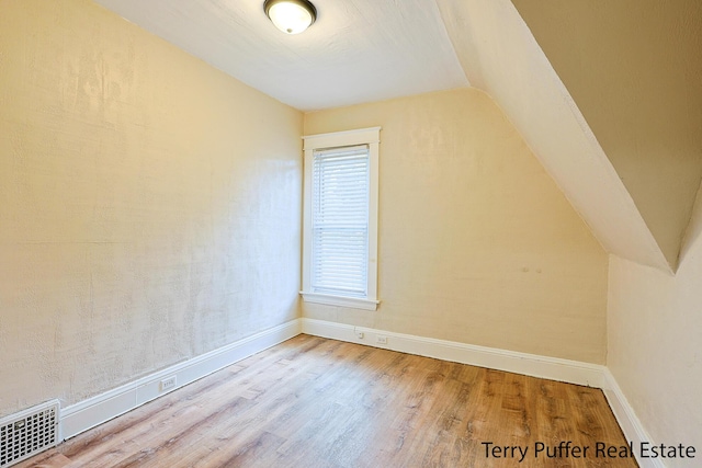 2550 Crozier Ave, Muskegon, MI 49441 - additional living space featuring wood finished floors and lofted ceiling