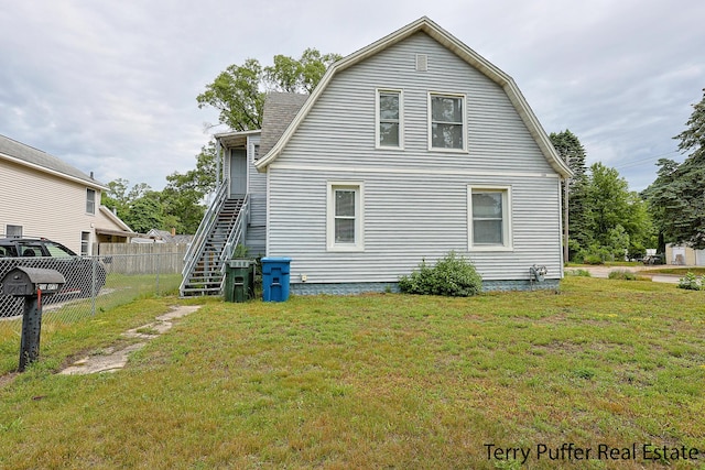 2550 Crozier Ave, Muskegon, MI 49441 - back of property with stairway and a gambrel roof