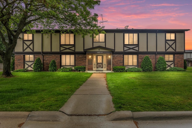 22811 Grove St, Saint Clair Shores, MI 48080 - view of front of home featuring brick siding and a front yard
