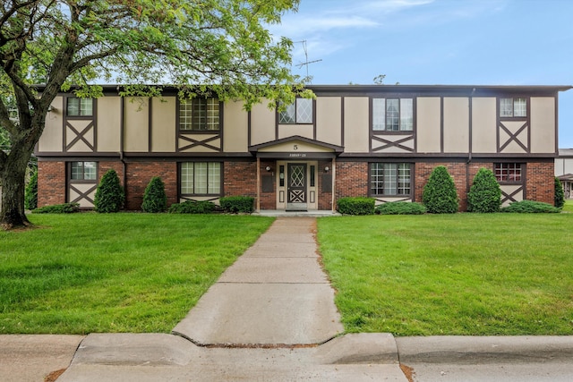 22811 Grove St, Saint Clair Shores, MI 48080 - view of front facade featuring brick siding and a front lawn